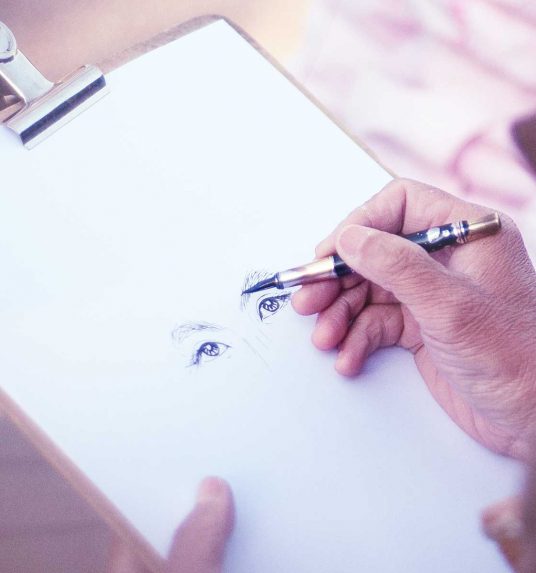 Elderly man taking an art class