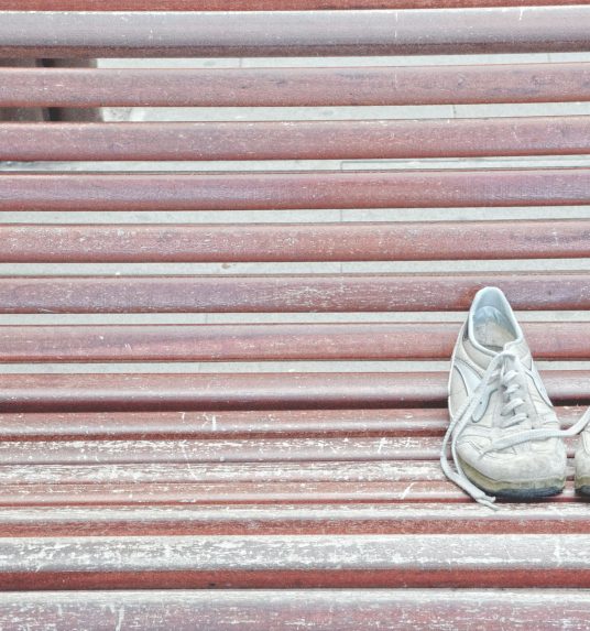 Tennis shoes worn by an active senior