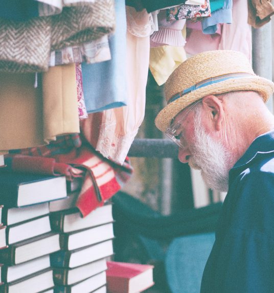 an elderly man socializing with the world