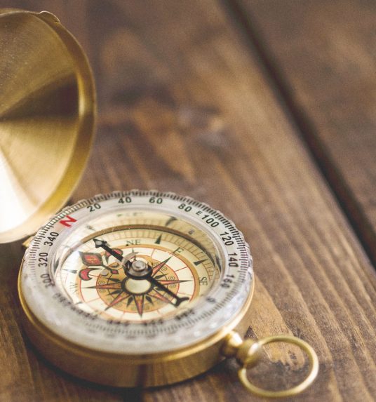 A compass, a representation of how we guide seniors through memory care