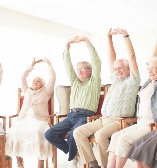 Seniors doing arthritis exercises
